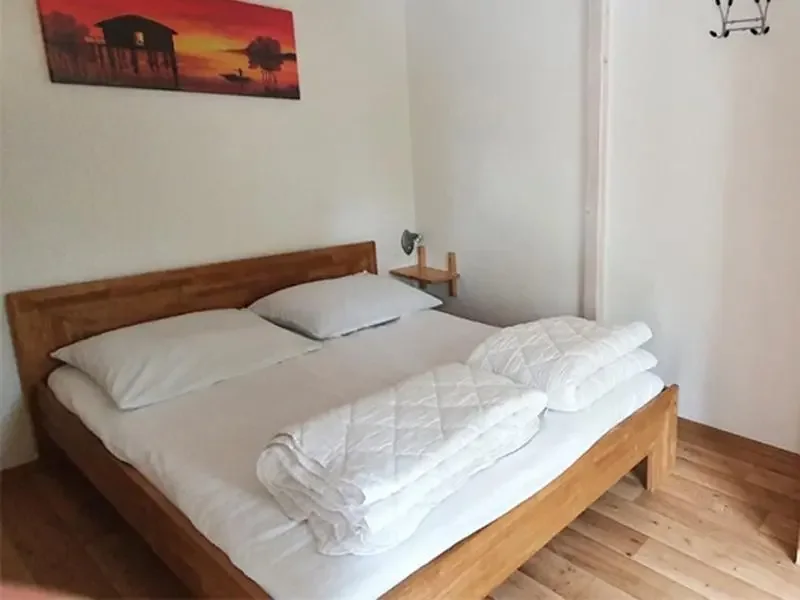 Bungalow 155 am Zeulenrodaer Meer – Schlafzimmer mit komfortablem Bett